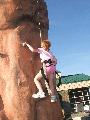 Kelly showing good form on climbing wall.